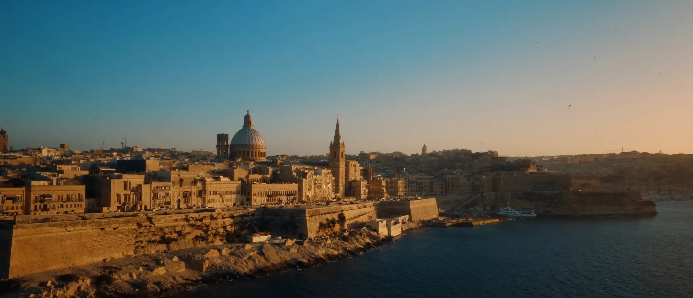 Illustration of Valletta and the Grand Harbour at golden hour