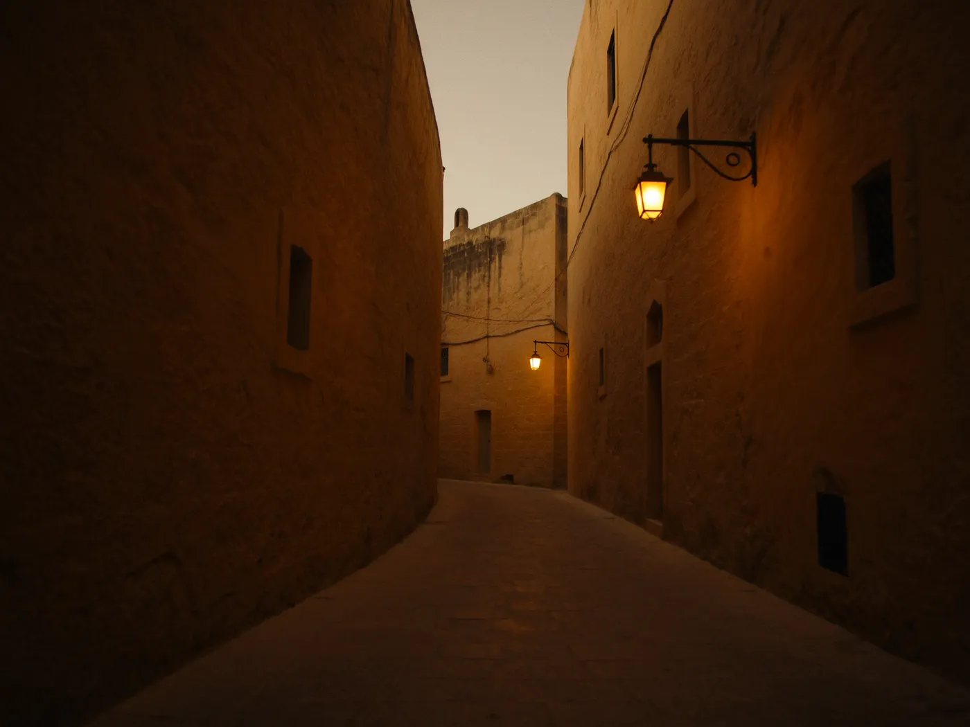 Illustration of a limestone street in Mdina at dusk